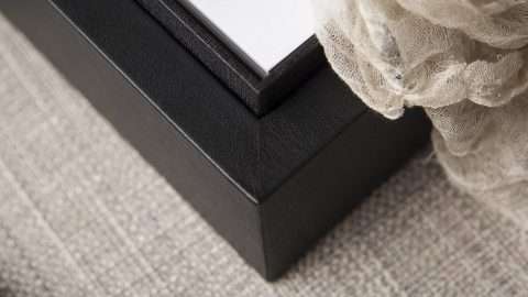 Interior is lined with a texture black paper
