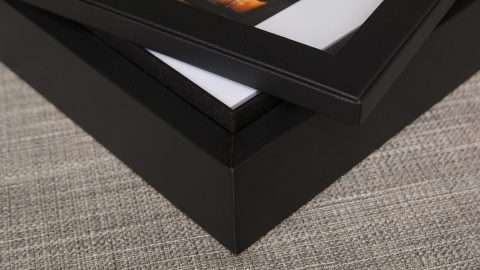 Designed with a sleek black leatherette texture