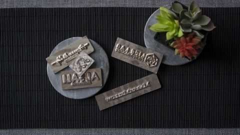 A metal block crafted with your logo used to deboss your Mats